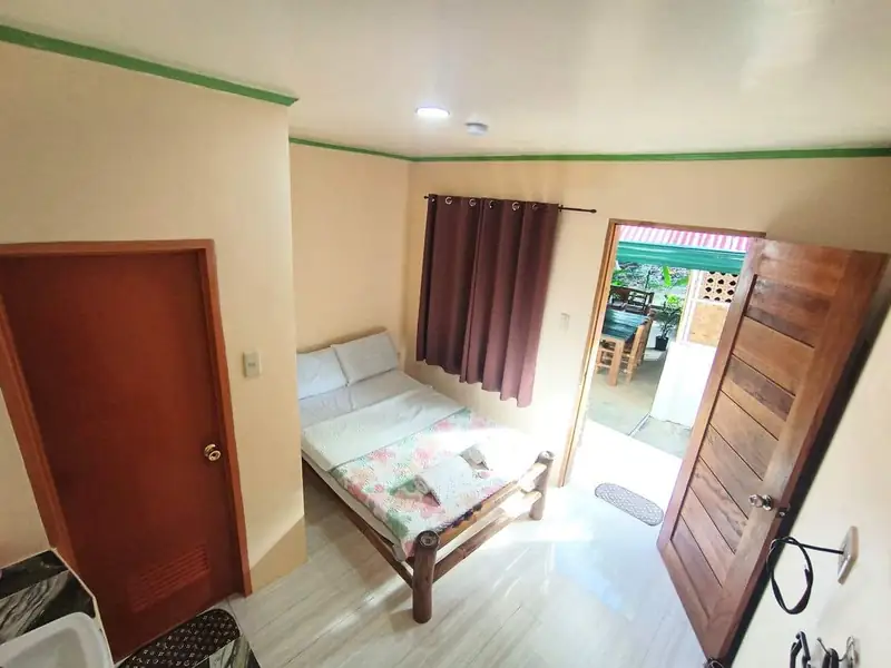 Garden View Room private patio — Rose Apartments Anda Bohol